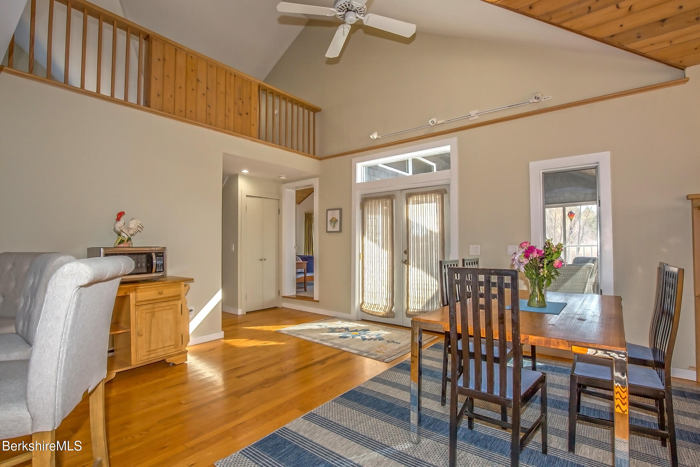 2 Wallace Road, Unit 2E Stockbridge, MA 01262 - Photo 6 of 50 a dining room with furniture and wooden floor