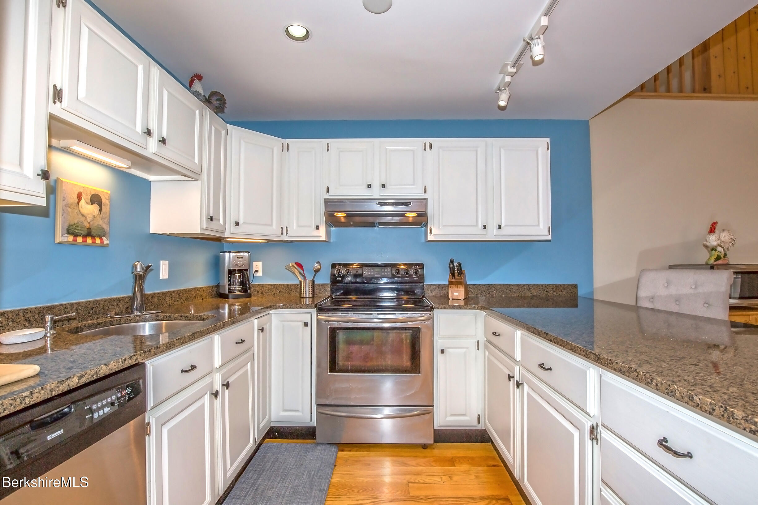 2 Wallace Road, Unit 2E Stockbridge, MA 01262 - Photo 7 of 50 a kitchen with stainless steel appliances granite countertop a sink stove and cabinets