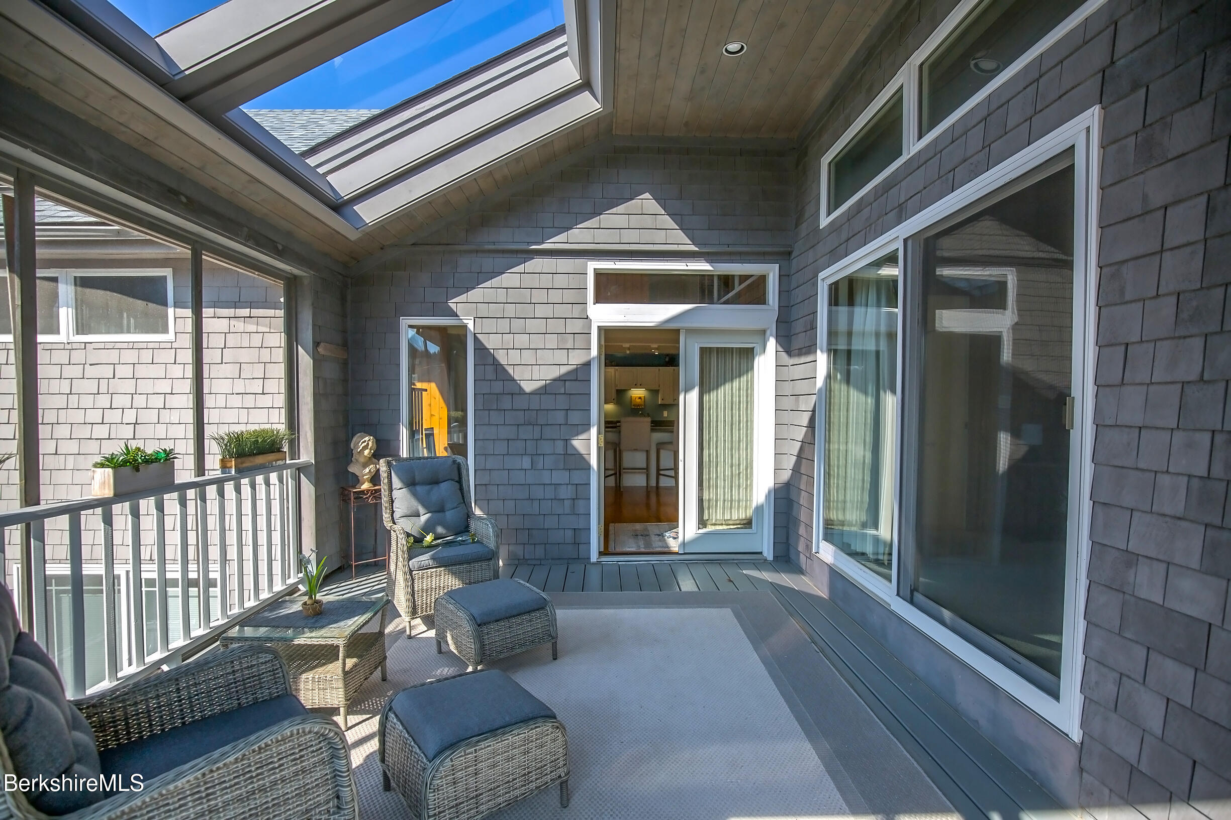 2 Wallace Road, Unit 2E Stockbridge, MA 01262 - Photo 8 of 50 a porch with chairs and door