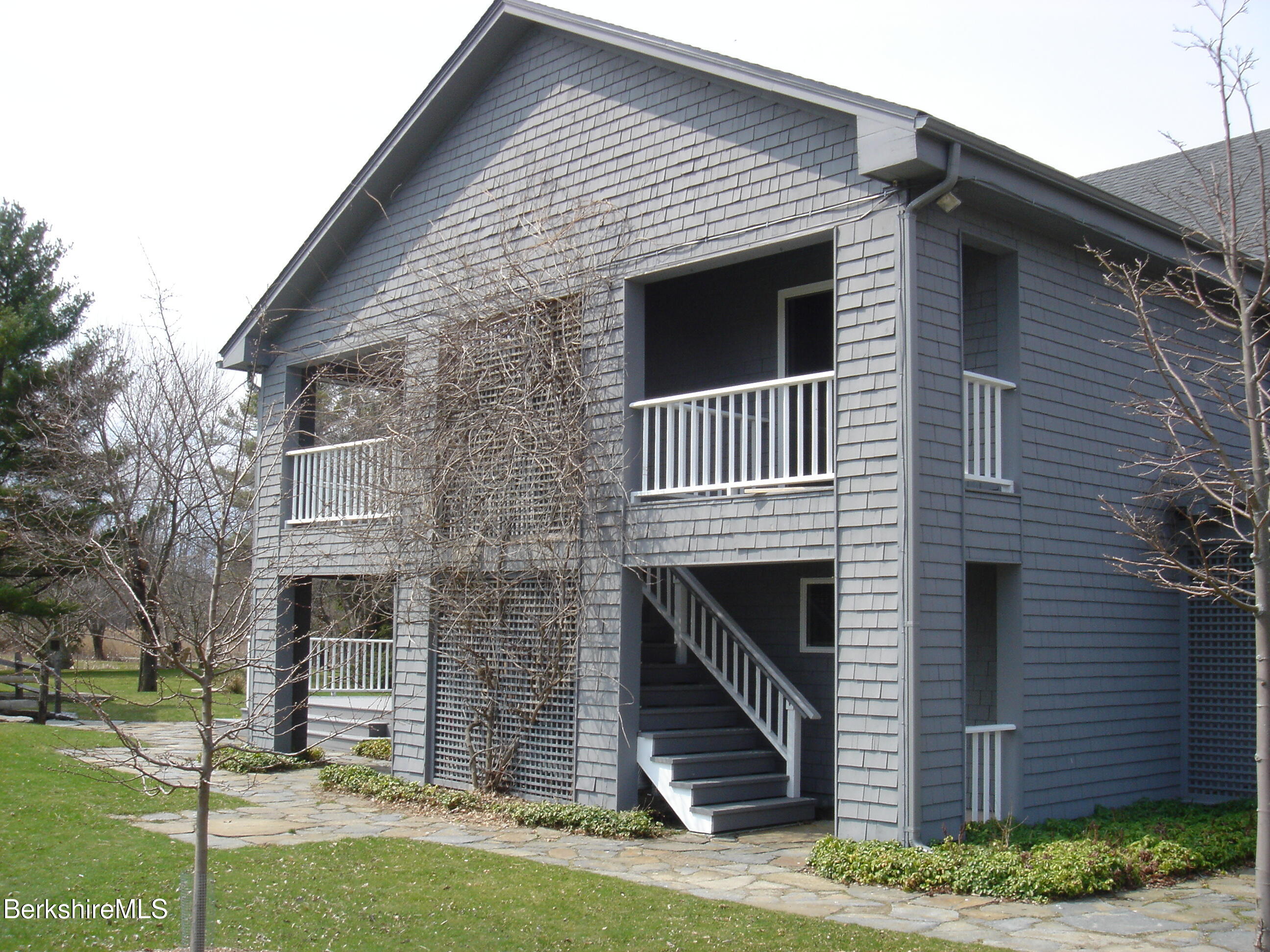 2 Wallace Road, Unit 2E Stockbridge, MA 01262 - Photo 10 of 50 a view of a house with a yard