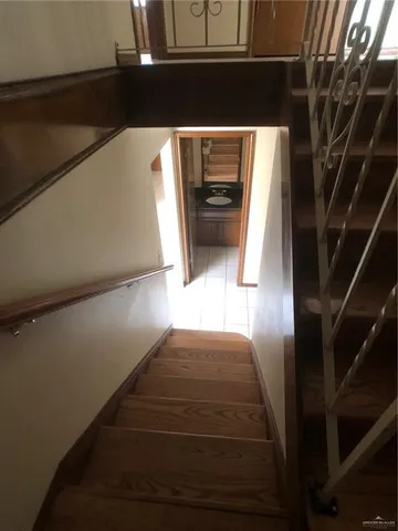 a view of an empty room and a window