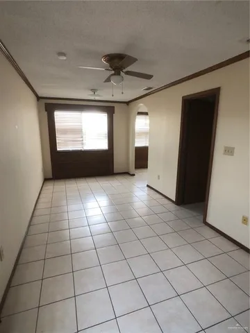 a spacious bathroom with a granite countertop sink and a mirror