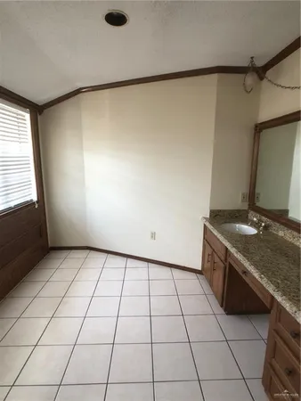 a view of empty room with windows