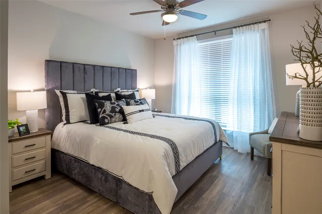 a bedroom with a bed and a window