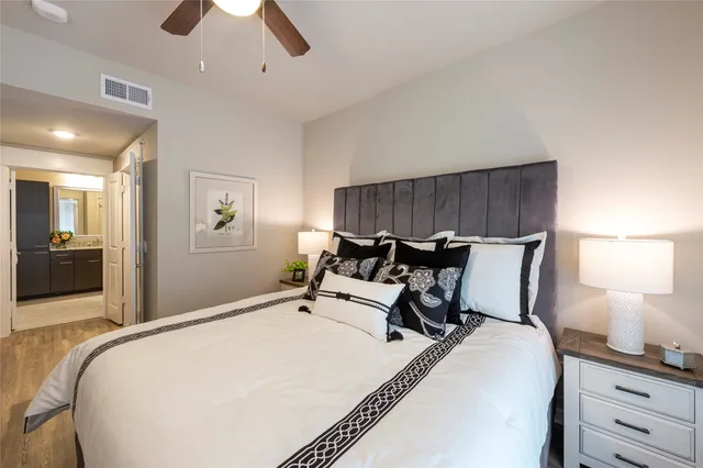 a bedroom with bed and window