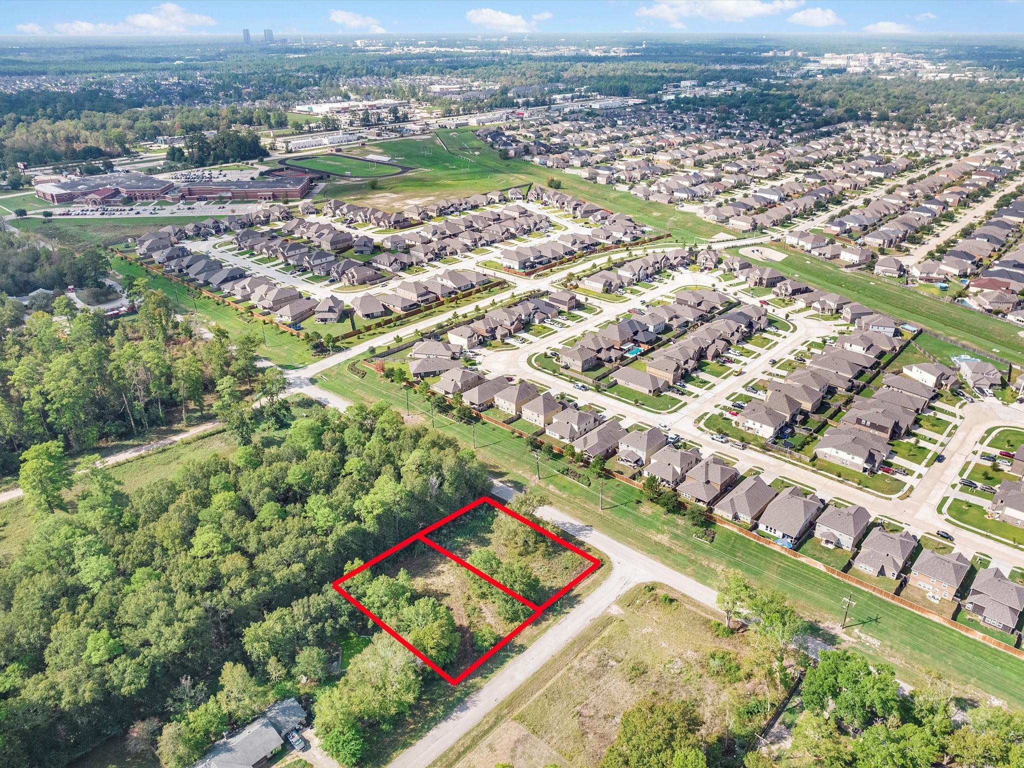97803 River Ridge Conroe, TX 77385 - Photo 2 of 4 an aerial view of residential houses with outdoor space