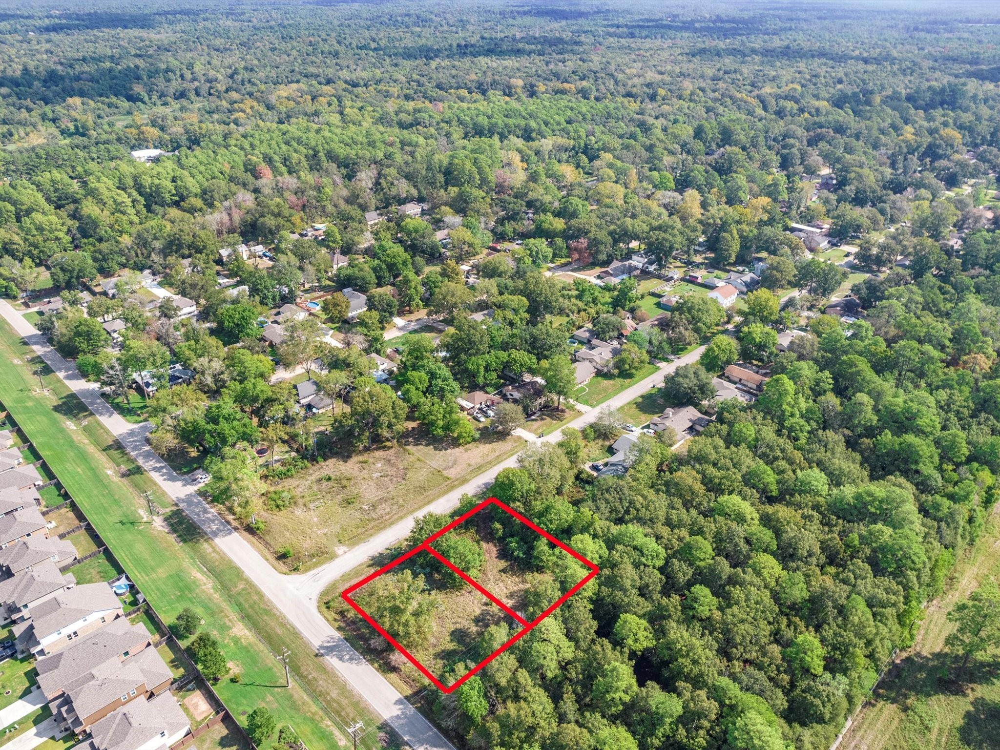 97803 River Ridge Conroe, TX 77385 - Photo 4 of 4 a view of an outdoor space with a street