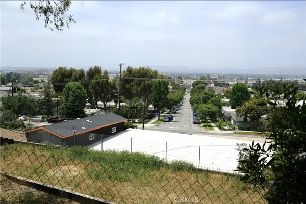 a view of a swimming pool with a yard