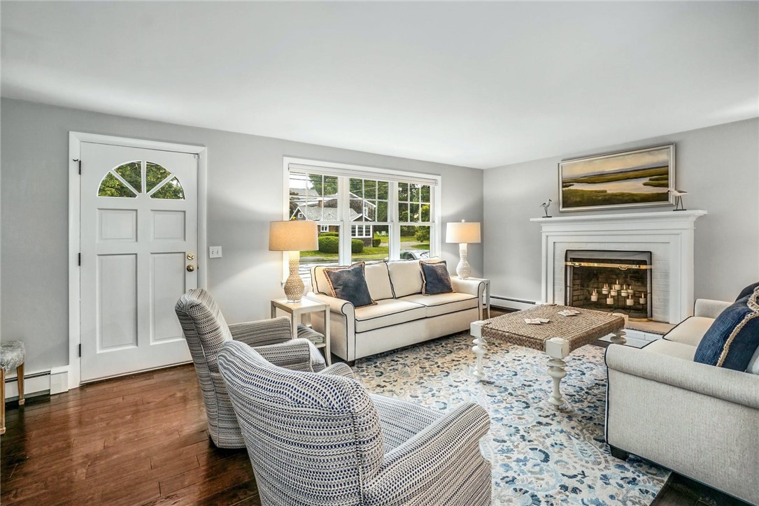21 North Road Jamestown, RI 02835 - Photo 21 of 38 Back inside, this living room with wood burning fireplace is 21' x 13'.