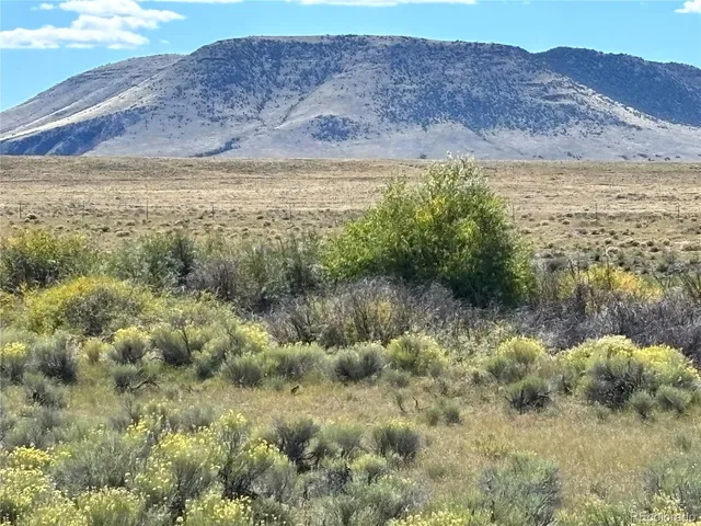 a view of ocean with mountain