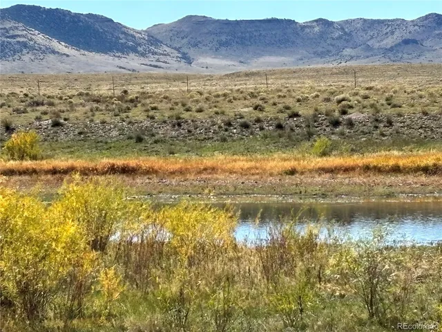 a view of an ocean and a mountain
