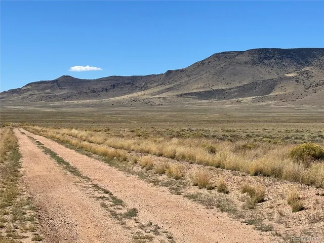 a view of a large body of water with a mountain in the background