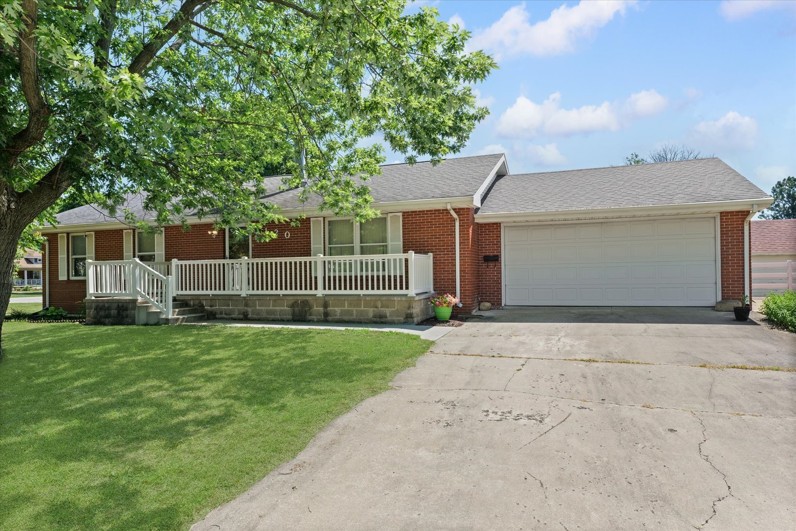 120 North Fredrick Street Rantoul, IL 61866 - Photo 1 of 46 a front view of a house with a garden and yard