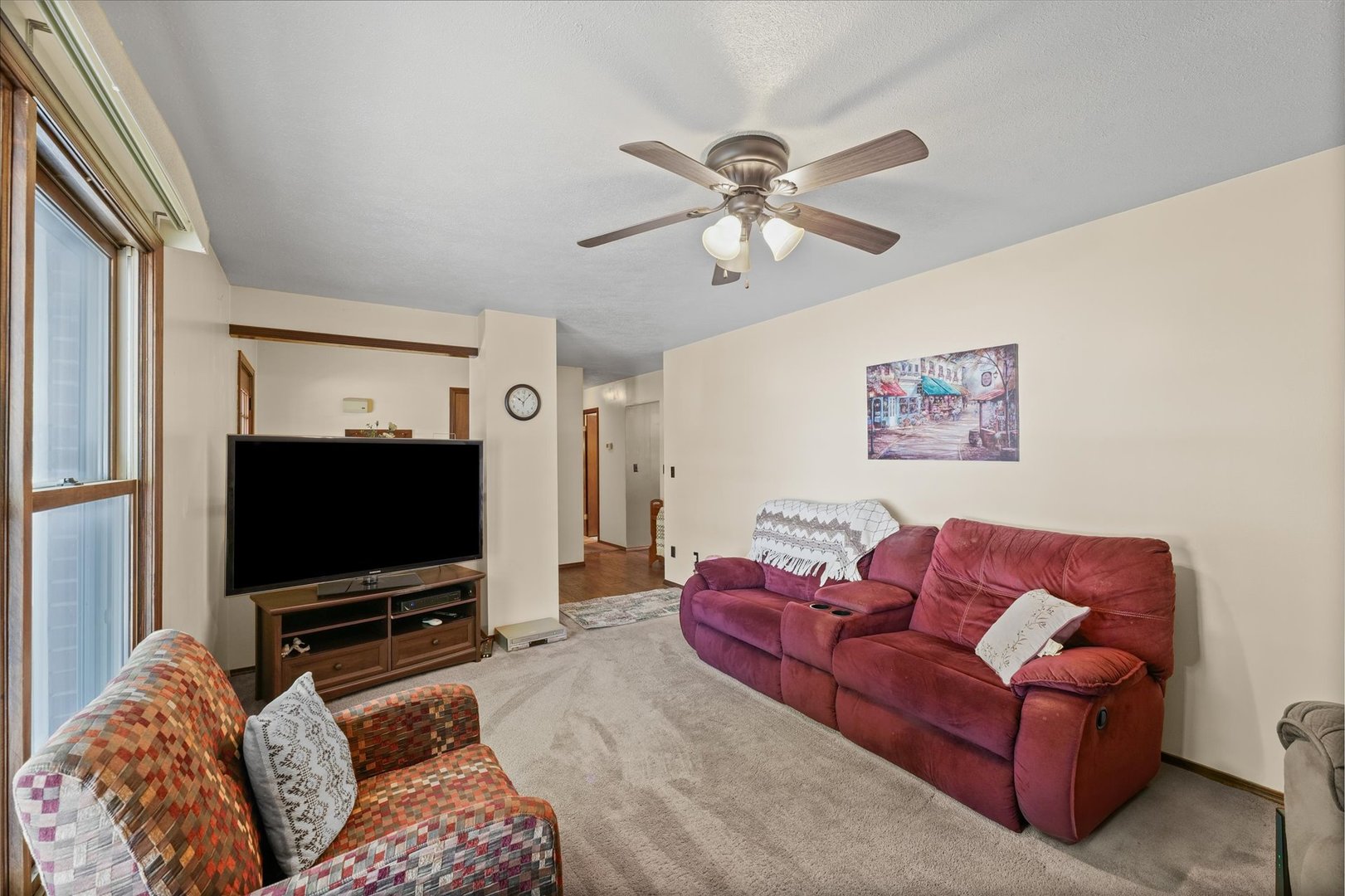 120 North Fredrick Street Rantoul, IL 61866 - Photo 12 of 46 a living room with furniture and a flat screen tv
