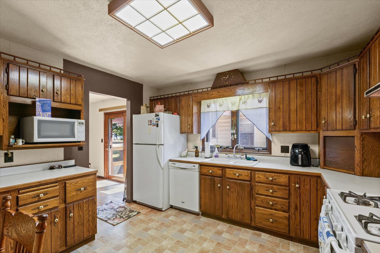 120 North Fredrick Street Rantoul, IL 61866 - Photo 15 of 46 a kitchen with stainless steel appliances sink cabinets and window