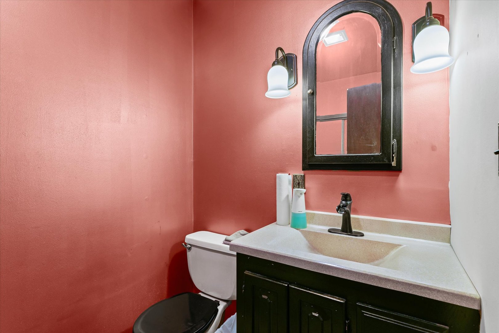 120 North Fredrick Street Rantoul, IL 61866 - Photo 18 of 46 a bathroom with a sink and a mirror