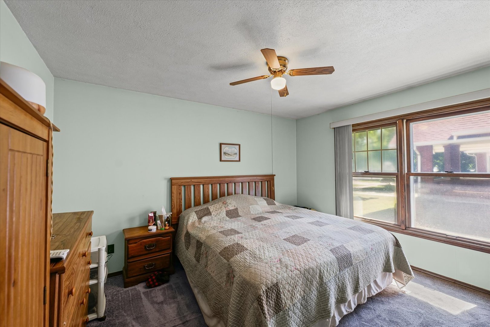120 North Fredrick Street Rantoul, IL 61866 - Photo 19 of 46 a bedroom with a large bed and a window