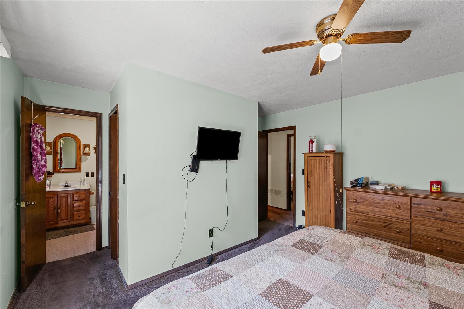 120 North Fredrick Street Rantoul, IL 61866 - Photo 20 of 46 a view of a bedroom with closet cabinet and flat screen tv