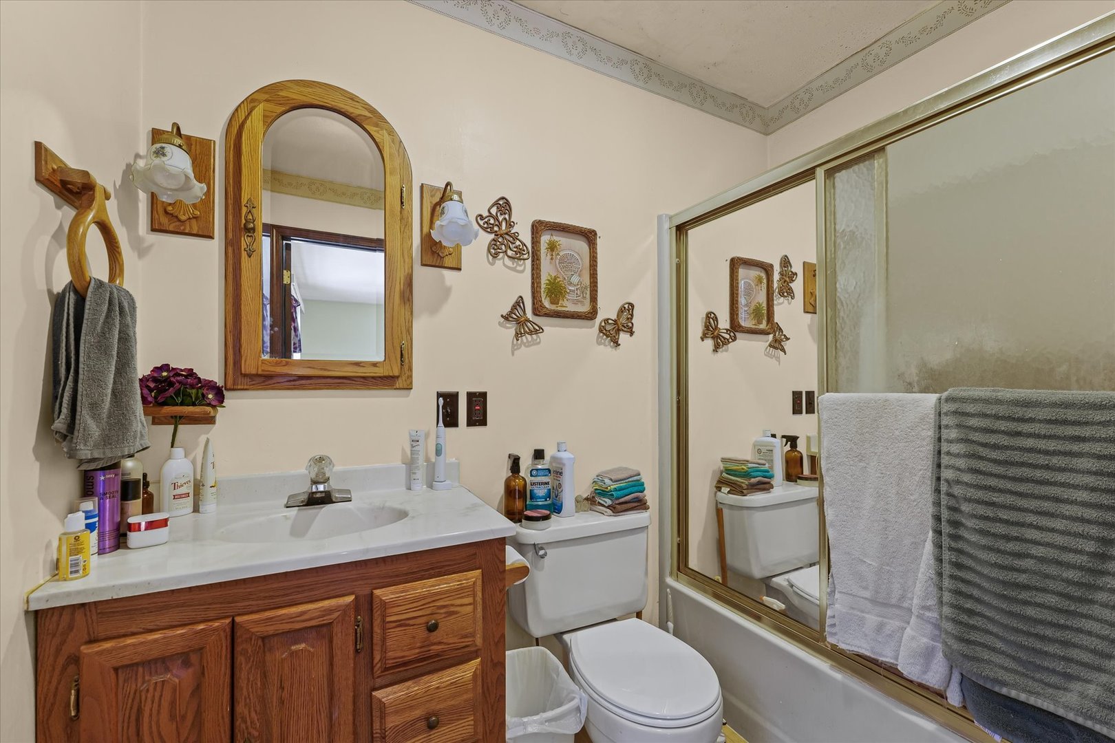 120 North Fredrick Street Rantoul, IL 61866 - Photo 21 of 46 a bathroom with a sink a toilet and shower curtain