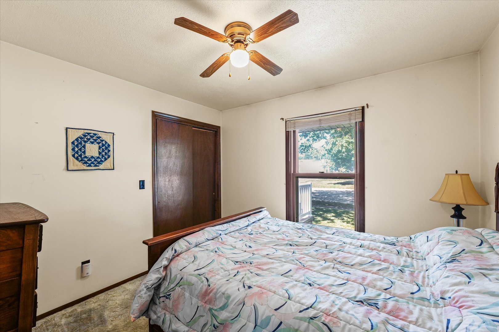 120 North Fredrick Street Rantoul, IL 61866 - Photo 24 of 46 a bedroom with a bed and a chandelier