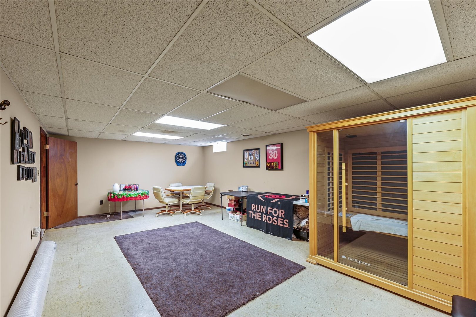 120 North Fredrick Street Rantoul, IL 61866 - Photo 26 of 46 a living room with lots of furniture and a flat screen tv