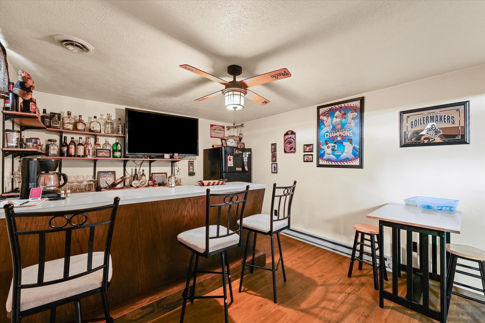 120 North Fredrick Street Rantoul, IL 61866 - Photo 32 of 46 a dining room with furniture and a flat screen tv