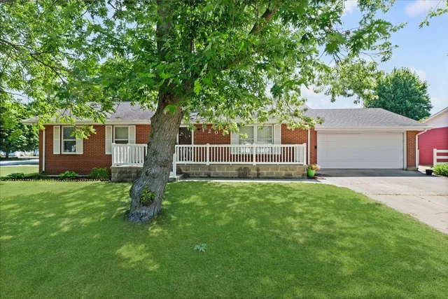 a view of backyard with a garden and entertaining space