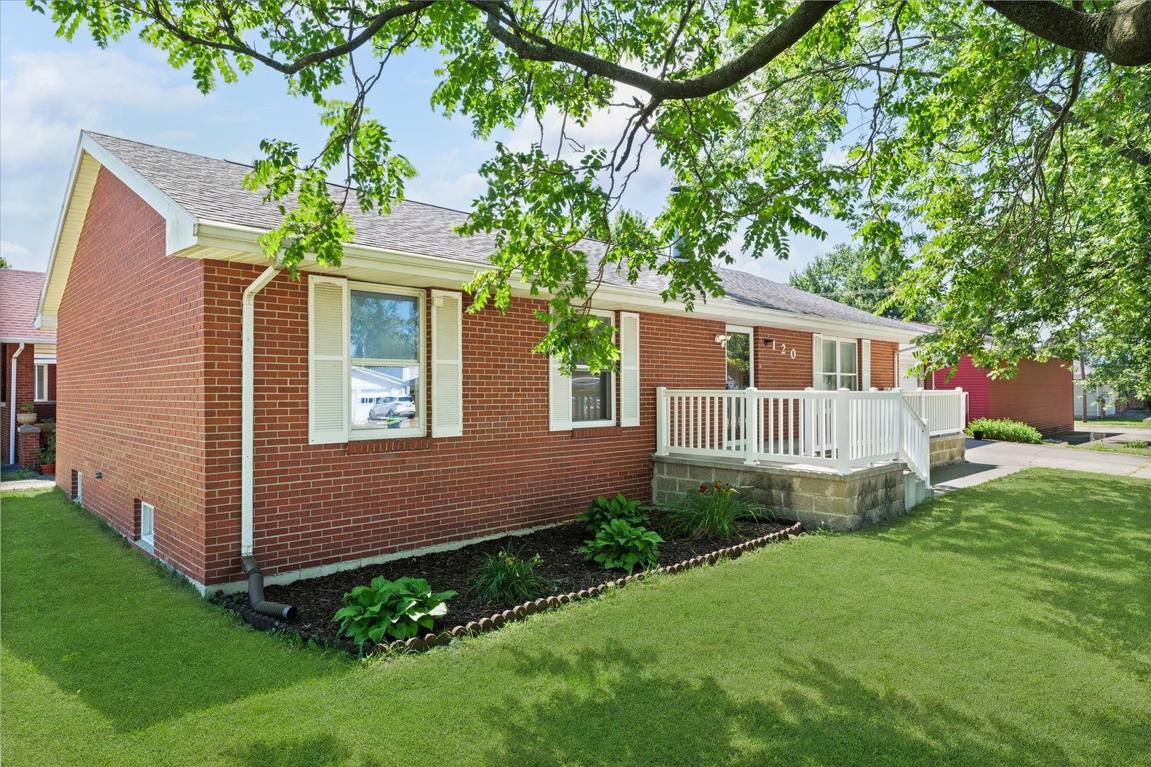 120 North Fredrick Street Rantoul, IL 61866 - Photo 7 of 46 a front view of a house with garden