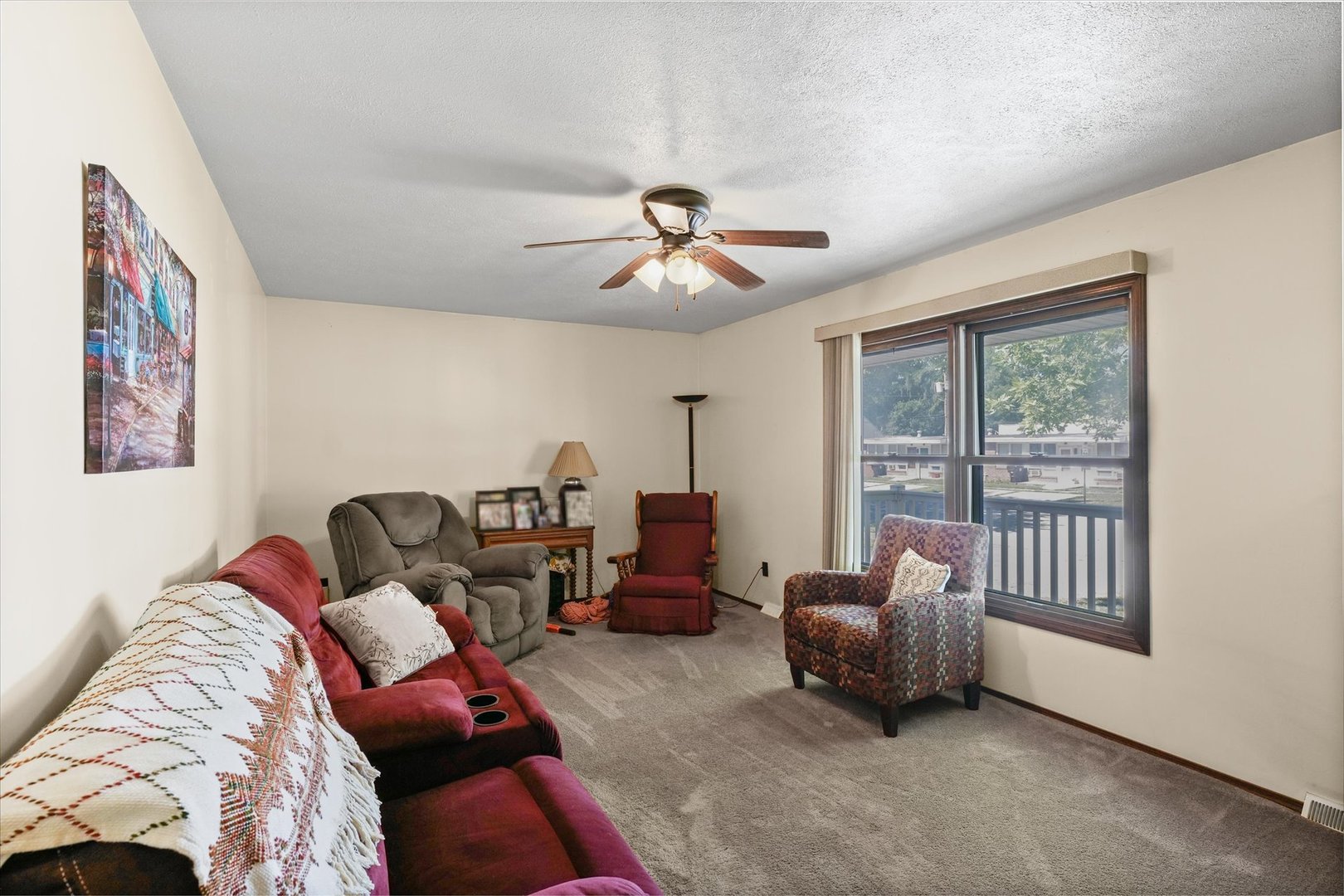 120 North Fredrick Street Rantoul, IL 61866 - Photo 10 of 46 a living room with furniture and a chandelier
