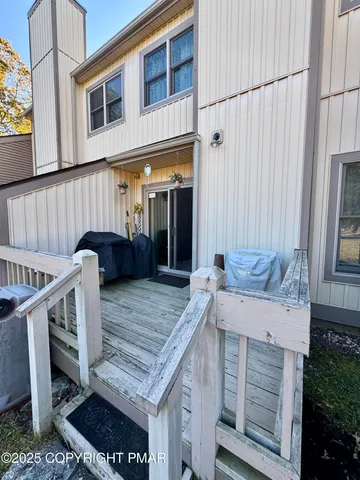 a view of a balcony with furniture