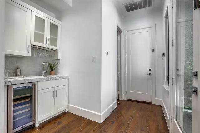 a view of cabinets and wooden floor