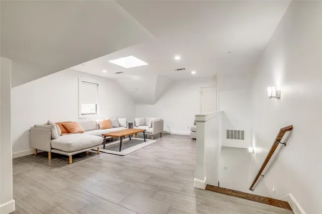 a living room with furniture and white walls