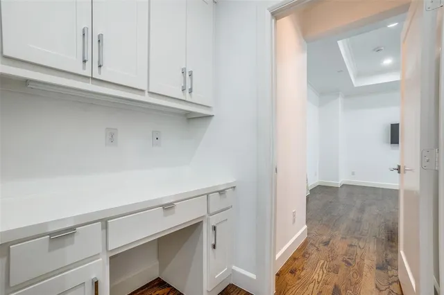 a view of cabinets and wooden floor