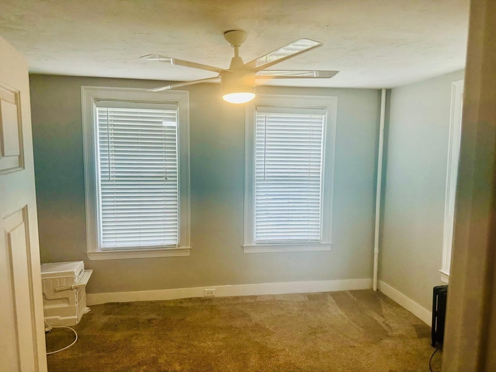 36 Cedar Street, Unit 1A Worcester, MA 01609 - Photo 13 of 19 a view of an empty room with a window
