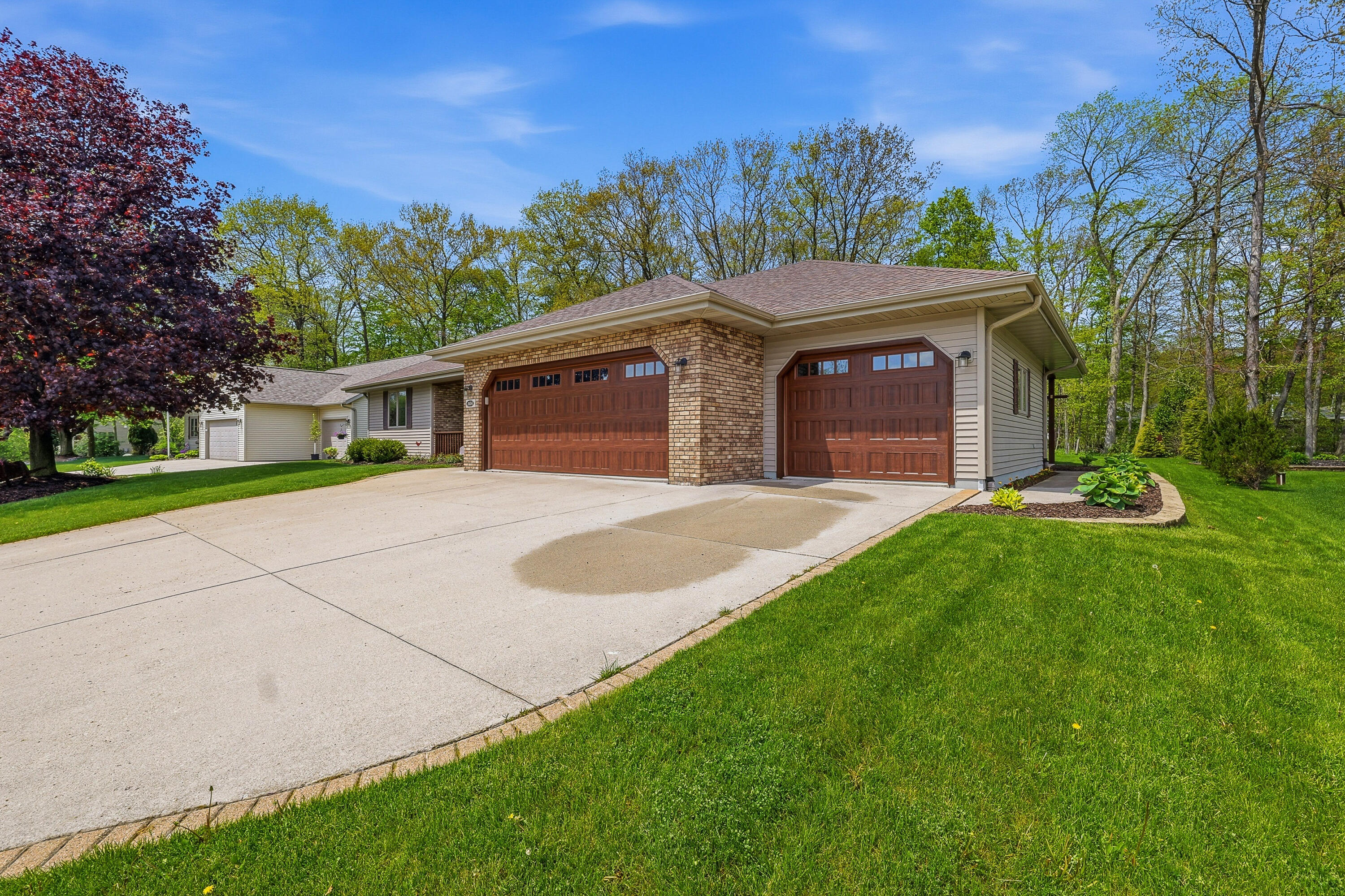 1616 Sandstone Lane Howards Grove, WI 53083 - Photo 31 of 47 Executive Brick Lined Driveway
