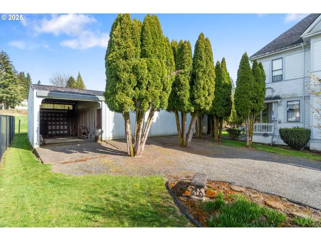 a view of house with backyard