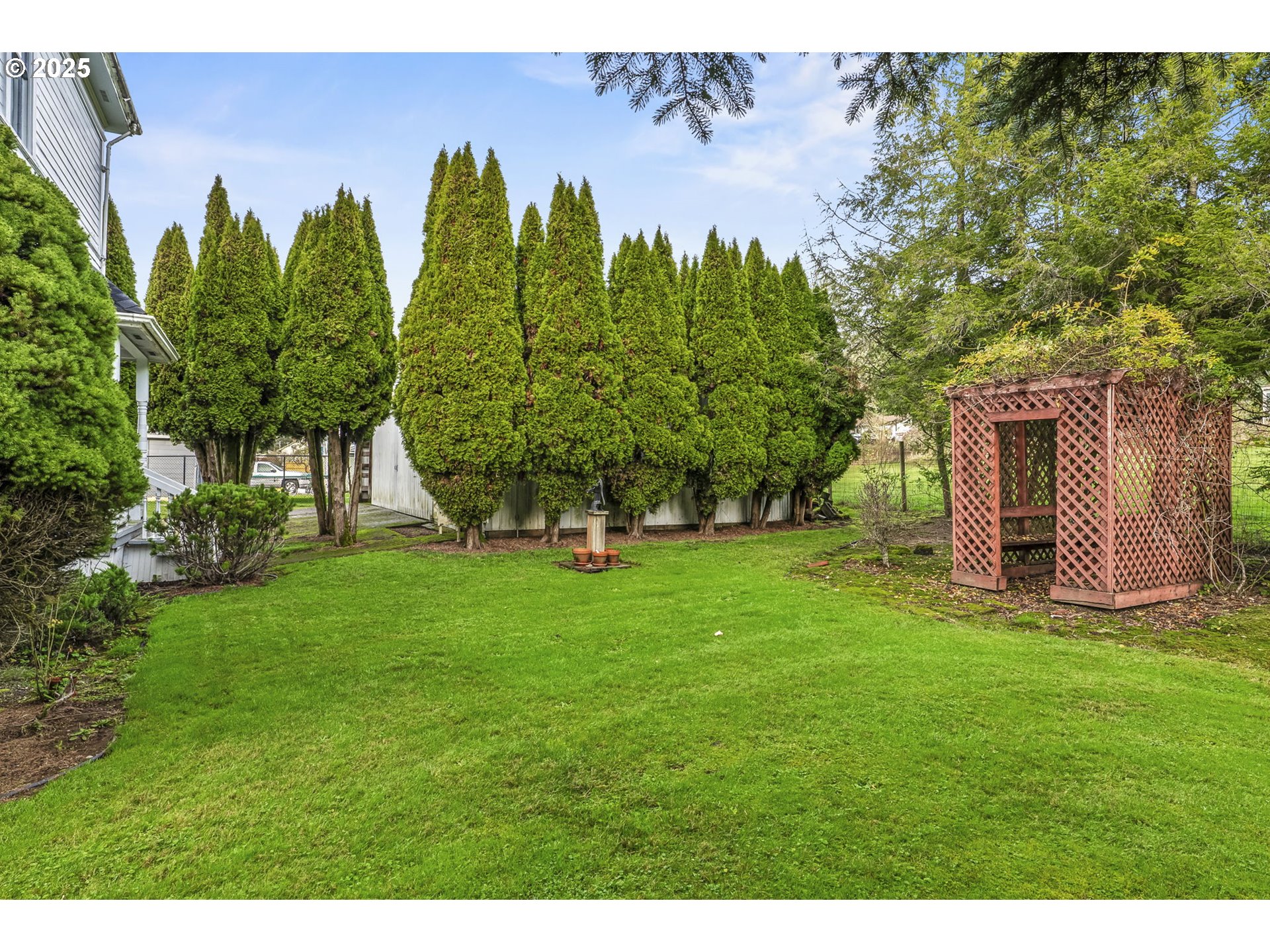 1110 D Street Vader, WA 98593 - Photo 37 of 45 a view of a garden with a building in the background