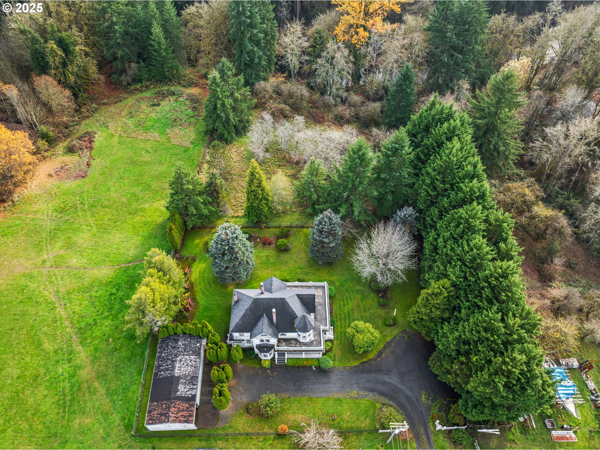 1110 D Street Vader, WA 98593 - Photo 43 of 45 an aerial view of a house with swimming pool a yard and lake view