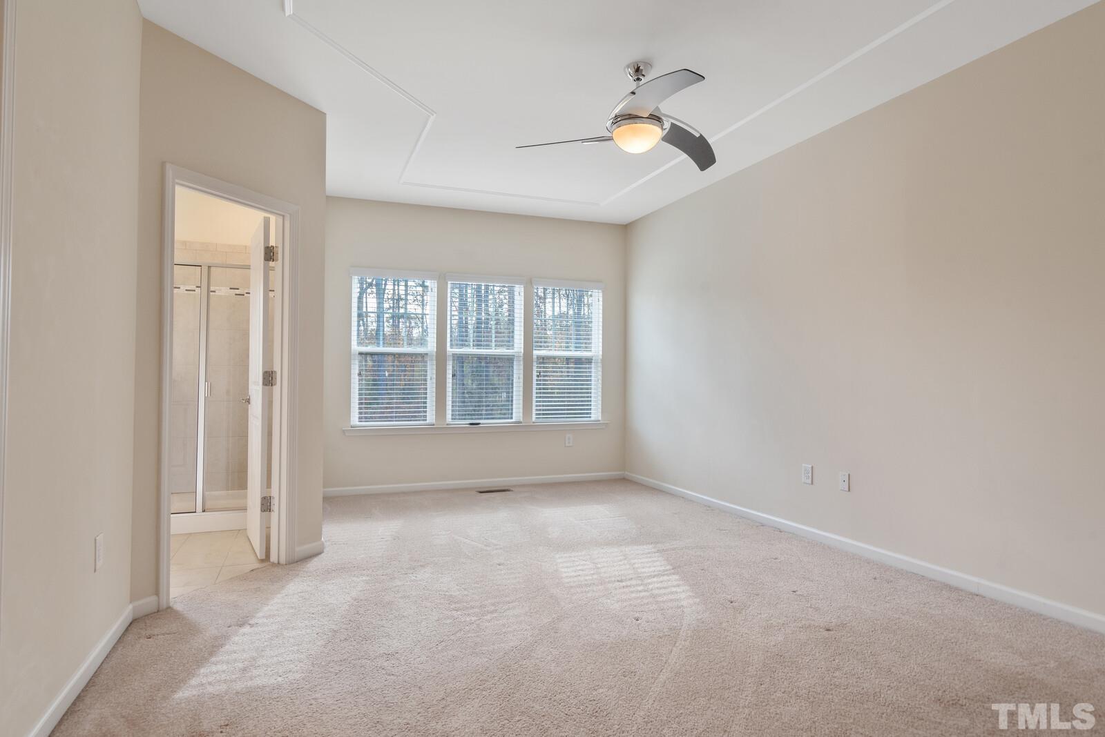 637 Edgewater Ridge Court Apex, NC 27523 - Photo 14 of 31 a view of an empty room with a window