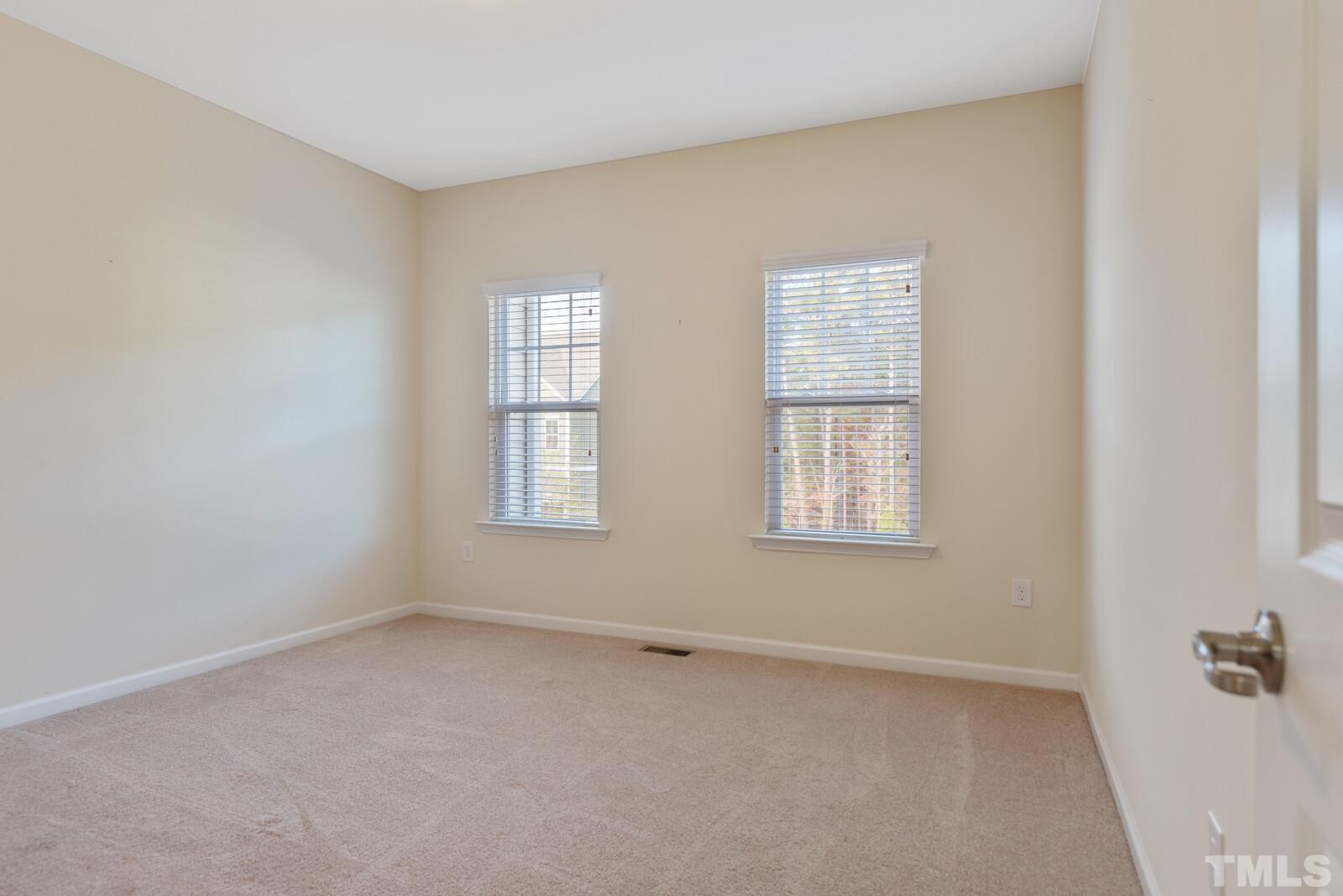 637 Edgewater Ridge Court Apex, NC 27523 - Photo 24 of 31 an empty room with a window