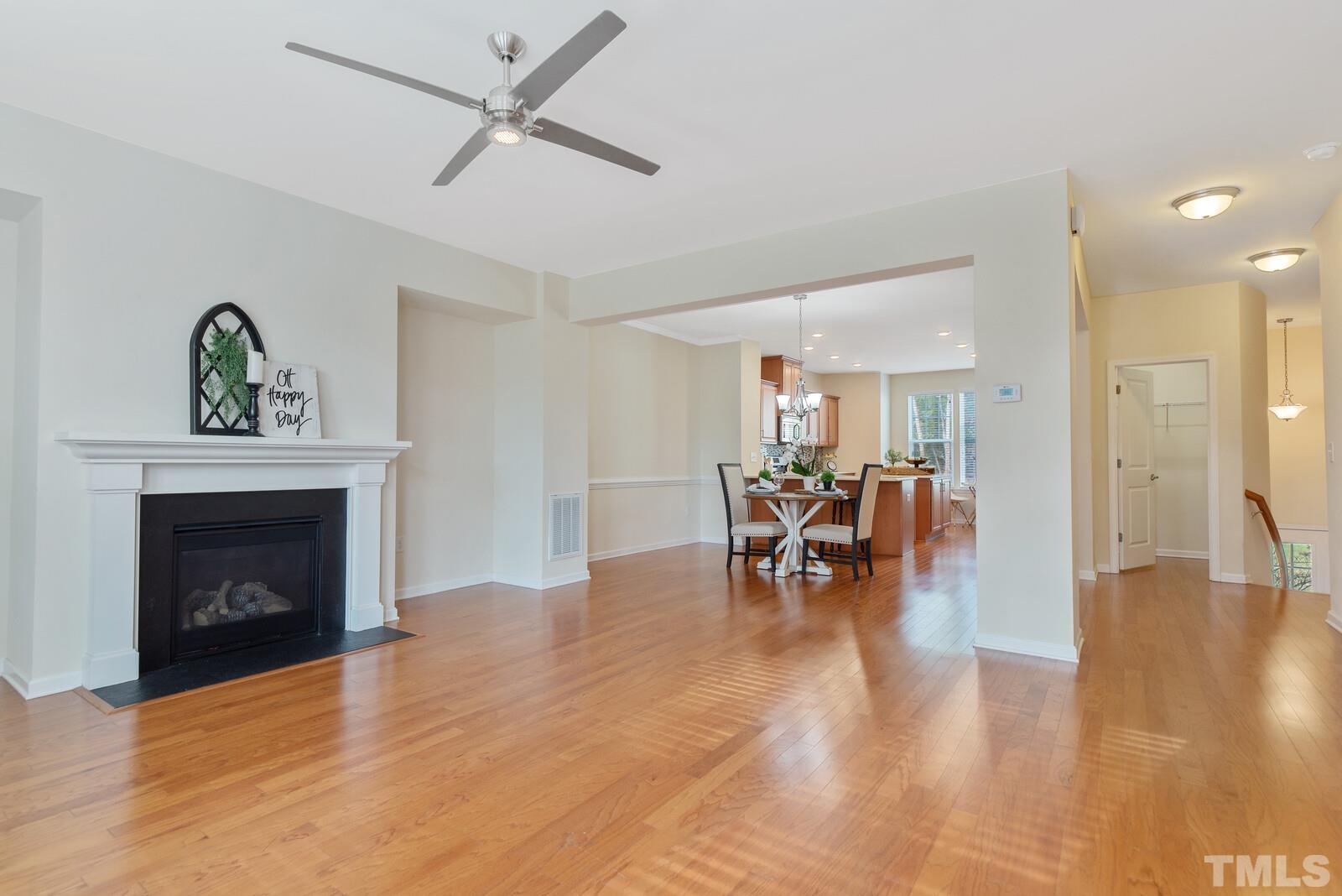 637 Edgewater Ridge Court Apex, NC 27523 - Photo 10 of 31 a view of a livingroom with furniture and a fireplace