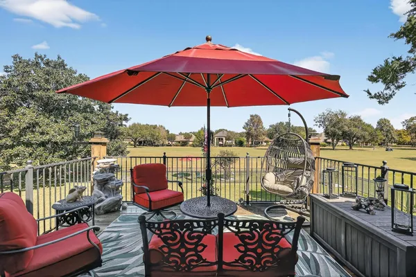 an outdoor space with furniture and umbrella