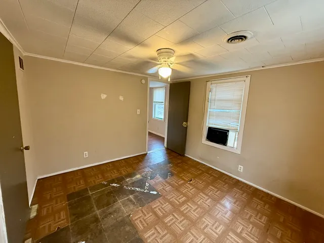 a view of an empty room with a window