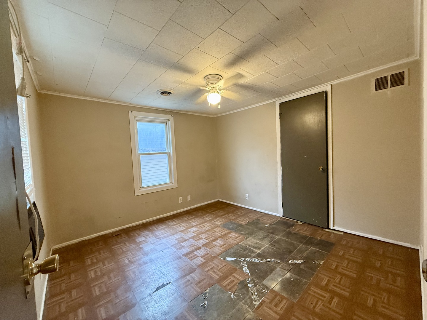 723 Richards Street, Unit 2 Joliet, IL 60433 - Photo 12 of 13 an empty room with windows and fan