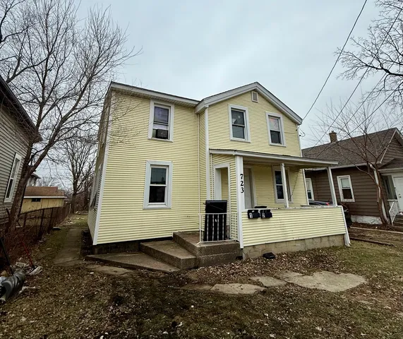 a view of a white house with a large windows