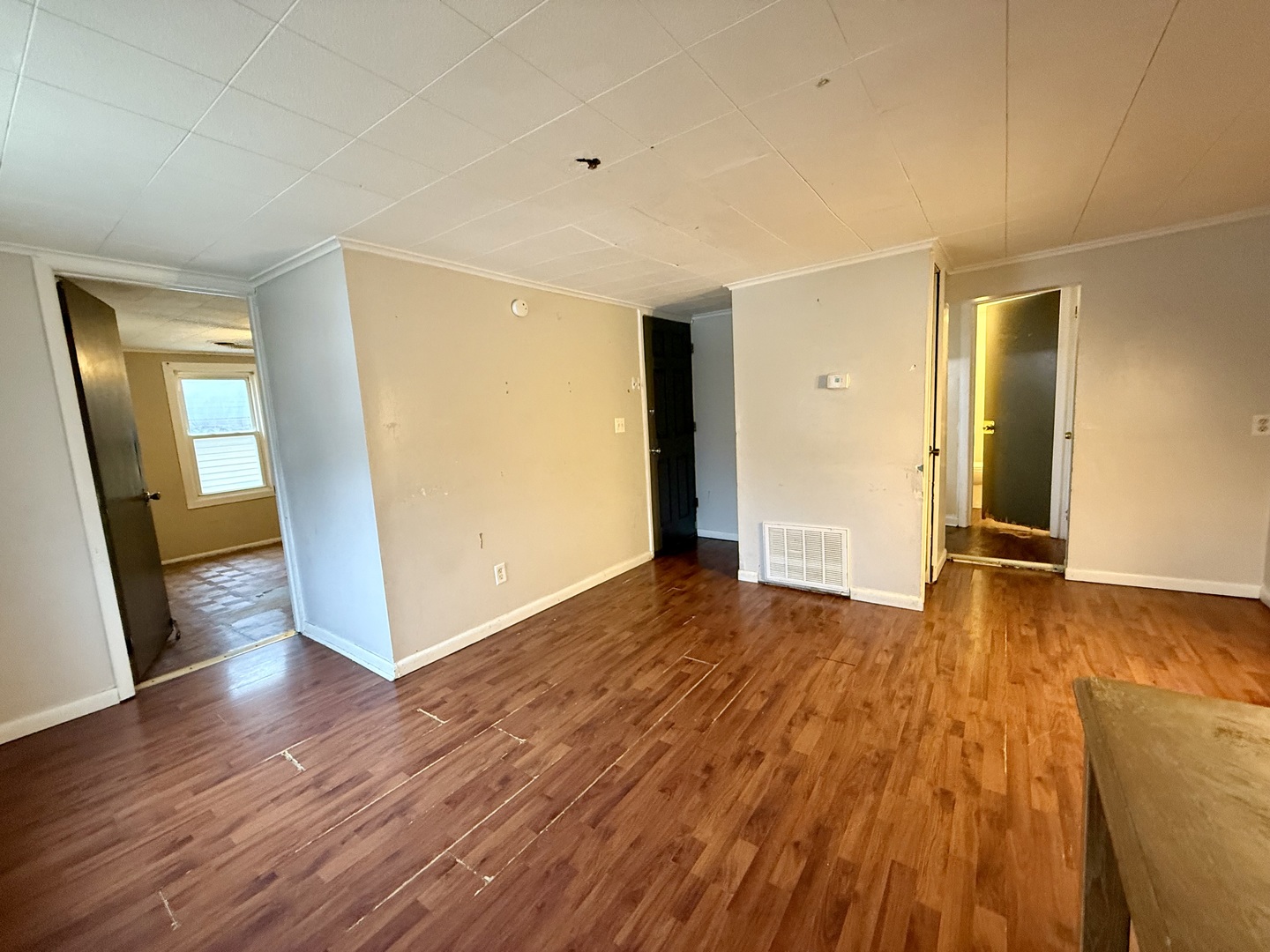 723 Richards Street, Unit 2 Joliet, IL 60433 - Photo 4 of 13 a view of a room with wooden floor and brick walls