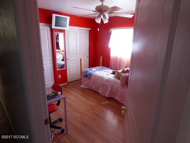 1403 Jeronimo Court Rio Rico, AZ 85648 - Photo 6 of 9 a bedroom with bed and a window