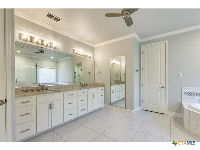 a kitchen with stainless steel appliances granite countertop a sink and a microwave