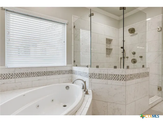a view of kitchen with cabinets