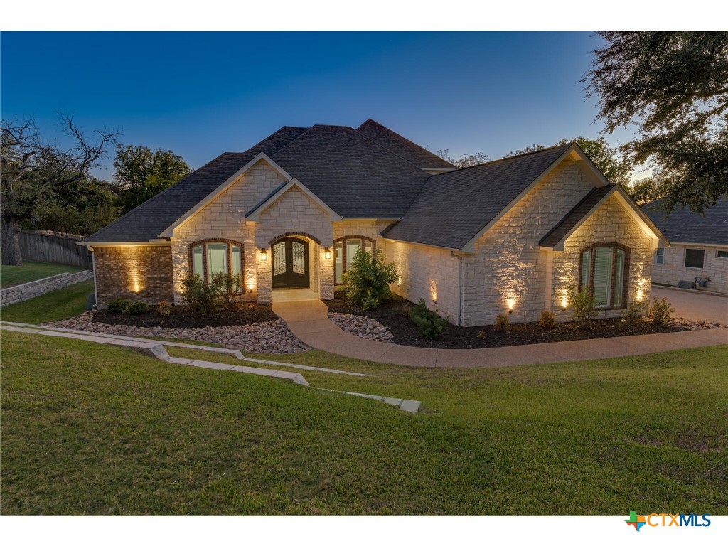 1729 Las Lomas Court Temple, TX 76502 - Photo 2 of 43 Front exterior at sunset showcasing architectural details